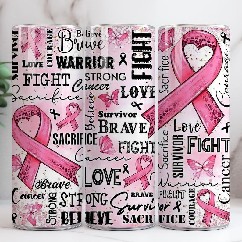 May include: Three pink and white tumblers with a pink ribbon design. The tumblers feature words such as "Survivor", "Brave", "Fight", and "Love", alongside pink butterflies. The tumblers are designed to raise awareness for cancer.