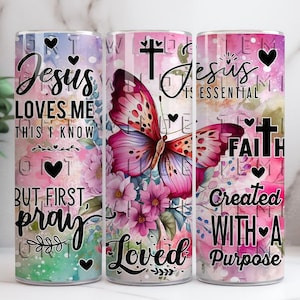 May include: A cylindrical tumbler featuring a butterfly and floral design. The tumbler is inscribed with the phrases "Jesus Loves Me This I Know But First Pray" and "Jesus is Essential Faith Created With A Purpose". Includes hearts and crosses.