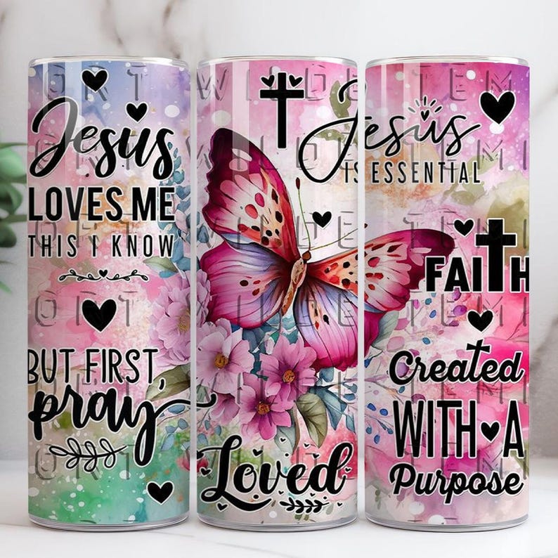 May include: A cylindrical tumbler featuring a butterfly and floral design. The tumbler is inscribed with the phrases "Jesus Loves Me This I Know But First Pray" and "Jesus is Essential Faith Created With A Purpose". Includes hearts and crosses.