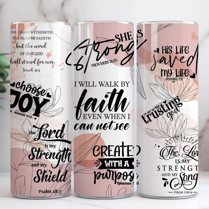 May include: Three white tumblers with floral designs and inspirational quotes in black script. The quotes include "Choose Joy," "She is Strong," and "His Life Saved." The tumblers have a pink and white colour scheme.