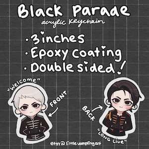 May include: A double-sided acrylic keychain with an epoxy coating. The front features a cartoon character with white hair in a black uniform, and the back shows a character with dark hair in a black uniform. The keychain is 3 inches in size.