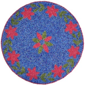 May include: A circular beaded placemat with a blue background. It features a design of red flowers and green leaves. This decorative item is likely intended for use on a dining table, adding a touch of colour.