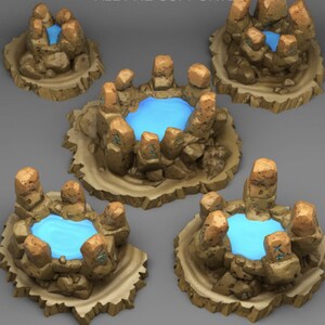 May include: Five miniature circular terrain pieces featuring a central pool of bright blue water surrounded by tan, textured rock formations. Each rock structure includes upright stone pillars with carved blue symbols on their surfaces.