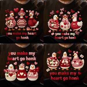 May include: A black sweatshirt with four duck designs, each wearing Valentine's Day outfits. The text "you make my heart go honk" is in red. Hearts and bows are also included in the designs.