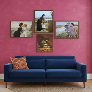 May include: A navy blue sofa with a decorative orange pillow sits below a gallery wall of framed art prints. The wall is painted a vibrant pink. The art prints depict scenes of people.