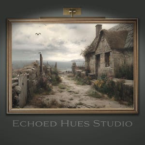 May include: Framed landscape art print of a stone cottage with a thatched roof, a path leading to the sea, and a cloudy sky. The artwork is in a gold frame and has the text "Echoed Hues Studio" at the bottom.