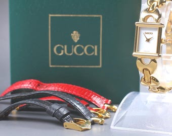 Reloj Gucci 1800L Gold Change Belt con esfera blanca y pulsera de cuarzo para mujer, fabricado en Suiza