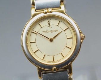 Orologio da donna vintage Yves Saint Laurent 2200-228481 con quadrante dorato e movimento al quarzo.
