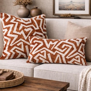 May include: A set of three ceramic mugs with a speckled, matte finish. The mugs are in shades of cream, light gray, and dark gray. Each mug has a simple, minimalist design, perfect for coffee or tea.