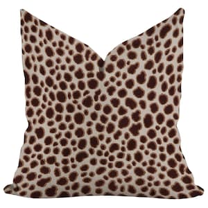 May include: Square throw pillow with a beige background and a repeating pattern of dark brown spots. The pillow has a soft, textured appearance, and the spotted design gives it a natural, animal-inspired aesthetic. The pillow is a decorative home accessory.