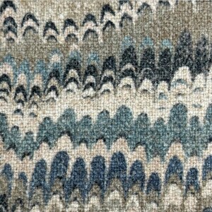 May include: A close-up of a fabric with a wavy pattern in shades of blue, brown, and beige. The fabric has a textured surface and a subtle sheen.