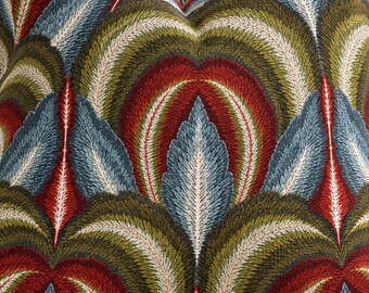 May include: A textile fabric featuring a repeating symmetrical pattern of stylized leaves in deep red, olive green, and slate blue. The design includes fine white stitching details that outline each leaf shape, creating a textured appearance.