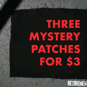 May include: A black square patch with the text "THREE MYSTERY PATCHES FOR $3" in red. The patch is on a textured gray surface. The words "RETIREMENT FUND" are at the bottom.