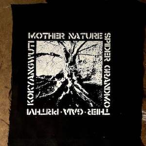 May include: Black and white patch with the text "MOTHER NATURE'S SPIDIER GRANDMOTHER", "THEIR WAVES", and "KOKYANGWUT" surrounding a black and white image of a tree with roots.