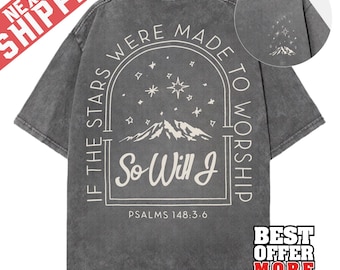 May include: Dark gray t-shirt with a graphic on the back that reads "If the stars were made to worship, so will I." The design includes stars, mountains, and text in a white font. The shirt has a vintage, washed look.