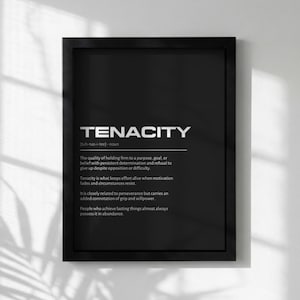 May include: Black framed print with the word "TENACITY" in silver lettering. The definition of tenacity is printed below in white text. The print is a motivational piece for home or office decor.