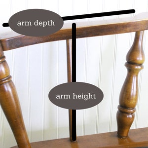 May include: A wooden rocking chair with a brown finish. The chair has a high back and arms. The arm depth and height are labeled in the image.