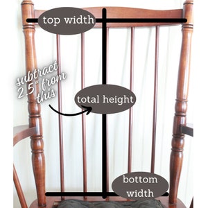 May include: A wooden rocking chair with a brown finish. The chair has a high back and a wide seat. The chair is labeled with measurements for the top width, total height, and bottom width.