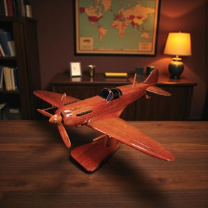May include: A wooden model airplane with a propeller and wings, displayed on a wooden stand. The airplane is a reddish-brown color and has a detailed design. The model is likely a decorative item.