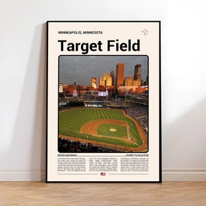 May include: A framed poster featuring Target Field in Minneapolis, Minnesota. The image shows the baseball stadium's field and seating area, with the city skyline in the background. Text at the top reads "Minneapolis, Minnesota" and "Target Field."