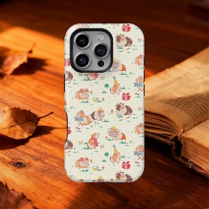 May include: A phone case with a repeating pattern of guinea pigs wearing party hats, bow ties, and glasses. The background is a light cream color with small green plants and red gift boxes. The case has a white border and a camera cutout.