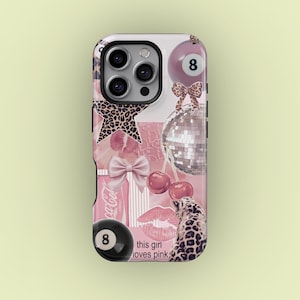 May include: A pink and white phone case with a collage design. The design includes a leopard print star, bow, disco ball, cherries, and a black eight ball. Text on the case reads "this girl loves pink."
