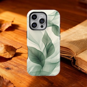 May include: A smartphone case with a white background and a green leaf design. The case has a camera cutout and black side buttons. The design features translucent green leaves over a white background.