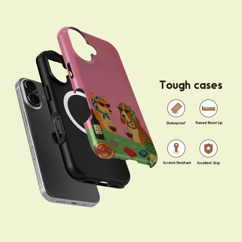 May include: A layered phone case with a pink exterior, black interior, and a silver phone. The pink case features a colourful illustration of two dogs wearing sunglasses and headscarves, playing poker. The text "Tough cases" is also visible.