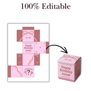 Op de afbeelding: Een roze en bruine geschenkdoos met een strikdesign en de tekst "Happy Birthday Anna!". De doos wordt zowel gemonteerd als een platte, bewerkbare sjabloon getoond. De woorden "Open Me!" en "What's Inside???" zijn ook zichtbaar.
