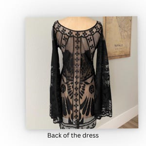 this is the back view for the black, sheer lace, gypsy dress with angel sleeves, and a scalloped hem
