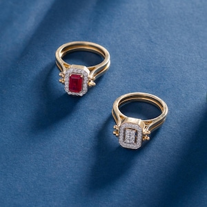 Anello vintage con rubino taglio smeraldo e contorno di diamanti.