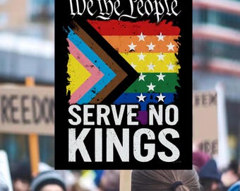 May include: A black sign with the words "We the People SERVE NO KINGS" in white. The sign features a rainbow flag design with white stars and a progressive pride flag design.