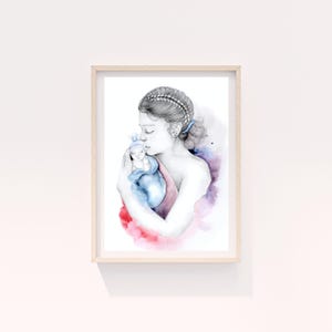 May include: Watercolor print of a mother cradling a baby, framed in light wood. The artwork features soft watercolor washes of red, blue, and purple. The mother's hair is styled in braids, and the baby is wrapped in a blue blanket.