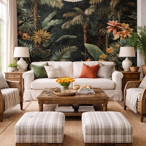 May include: A living room with a tropical mural, white sofa, and wooden coffee table. Two striped ottomans sit on a woven rug. Two white lamps flank the sofa, and a chandelier hangs from the ceiling.