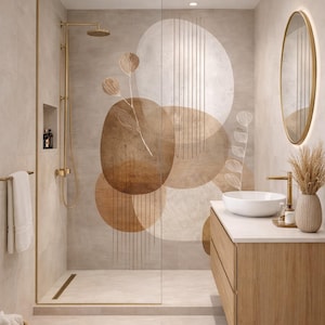 May include: A modern bathroom with a neutral color palette. The shower features a glass enclosure and gold fixtures. The wall has a large abstract mural with brown and beige circular shapes. A wooden vanity with a white countertop and a round mirror complete the space.