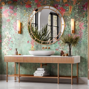 May include: A luxurious bathroom with a gold-framed mirror, a white sink, and a gold console table. The walls are adorned with floral wallpaper, and the room is illuminated by sconces. The overall theme is elegance and sophistication.