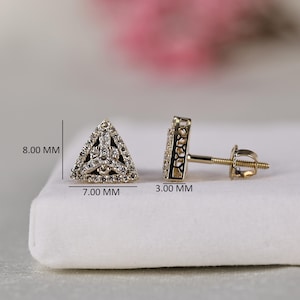 May include: A pair of triangular stud earrings featuring a pavé-set diamond pattern. The front face measures 8.00 mm by 7.00 mm, and the side profile shows a depth of 3.00 mm. The earrings include a threaded post and a secure screw-back closure.