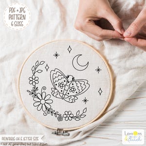 May include: A round embroidery hoop with a cream-colored fabric featuring a black line drawing of a butterfly, flowers, stars, and a crescent moon. The text "PDF + JPG PATTERN 6 SIZES" is in the upper left corner. The text "PRINTABLE: A4 & LETTER SIZE" is at the bottom.