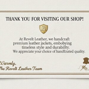 May include: A cream-coloured card with a gold border and text that reads "THANK YOU FOR VISITING OUR SHOP!". The card also includes the text "At Revelt Leather, we handcraft premium leather jackets..." and "Warmly, The Revelt Leather Team."