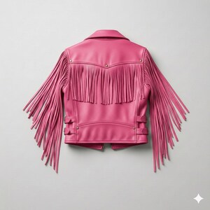 May include: A bright pink leather jacket with long fringe detailing on the sleeves and back. The jacket has a classic collar, snap closures, and metal studs. This stylish outerwear piece is a bold fashion statement.