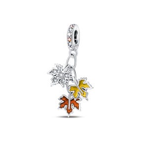 May include: A silver charm featuring three maple leaf pendants. One leaf is encrusted with clear crystals, and the other two are painted in autumn colours of yellow and orange. The charm has a decorative top with clear crystals.