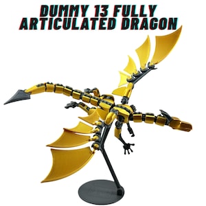 May include: A fully articulated dragon toy in gold and black. The dragon has large, stylized wings and a long, segmented body. The text "DUMMY 13 FULLY ARTICULATED DRAGON" is displayed in red and blue.