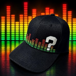 May include: A black baseball cap featuring an embroidered graphic of a colorful sound equalizer bar pattern in shades of red, orange, yellow, and green, with a large, white, embroidered question mark symbol positioned on the front panel.