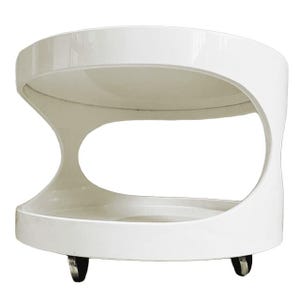 May include: A glossy white circular two-tier side table with a curved, open-sided frame and a smooth, continuous silhouette. The piece features a flat top surface and a lower shelf, supported by small, dark, functional casters at the base.