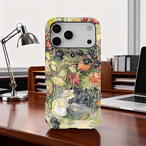 May include: A phone case with a detailed illustration of a forest scene, including blackberries, leaves, and a small creature. The case has a colourful design with an artistic style, and a camera cutout.