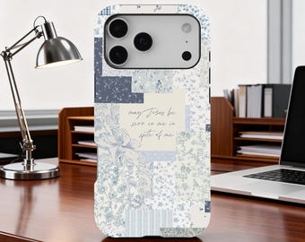 May include: A phone case with a patchwork design in shades of blue and white. The case features floral and geometric patterns, with the text "may Jesus be seen in me in spite of me."