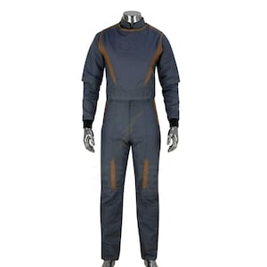 May include: A gray jumpsuit with brown accents. The long-sleeved top has a high collar and brown trim along the shoulders and chest. The pants have brown patches on the legs. Black cuffs are at the wrists and ankles.