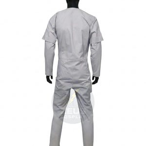 May include: A light gray jumpsuit with long sleeves and a round neckline. The jumpsuit has a fitted silhouette and a zipper closure. The model is wearing black gloves. The jumpsuit is made of a lightweight fabric.