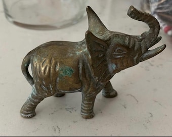 Vintage Brass Elephant figurine roughly 4.5” long and 4.25” in height