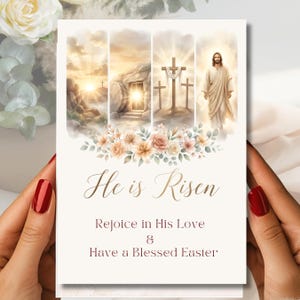 May include: A cream-colored Easter greeting card with the words "He is Risen." The card features watercolor illustrations of a sunrise, an empty tomb, crosses, and Jesus. Floral accents and the message "Rejoice in His Love & Have a Blessed Easter" are also included.